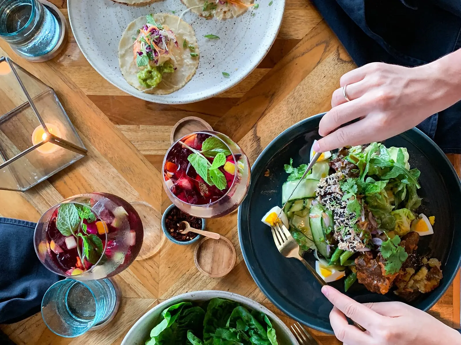 A close up of people eating food from above