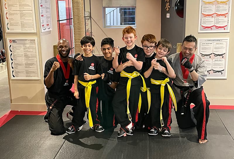 Two Meiji Senseis' with a group of their younger students with their yellow belts