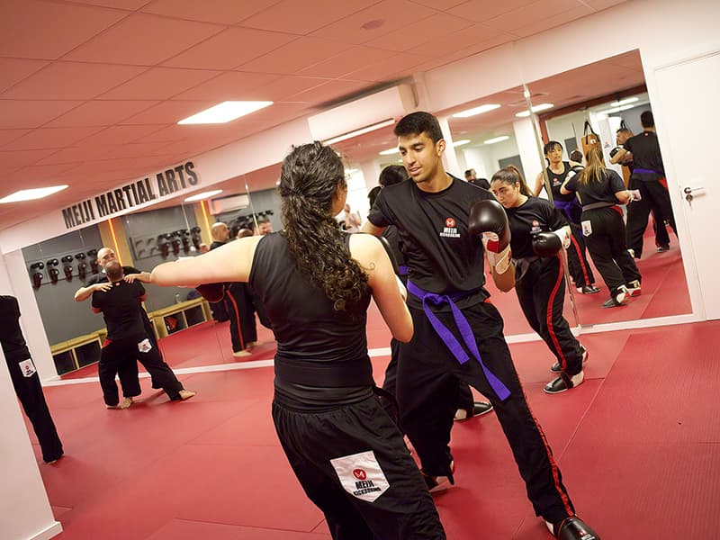 Students practicing Kickboxing at the Temple Fortune Dojo, London