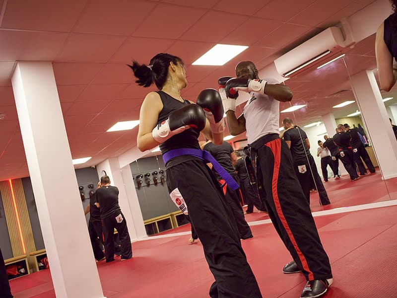 Students practicing Kickboxing at the Temple Fortune Dojo, London