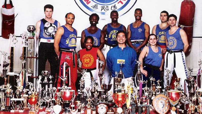 Sensei Denise Bailey with kickboxing and martial arts trophies