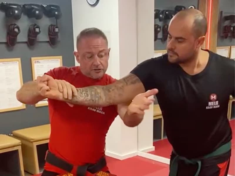 Master Mark Roberts demonstrates a move with a student