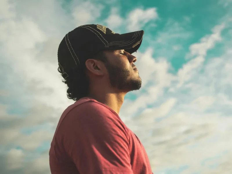 Man wearing black cap