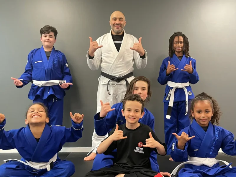 A group of Jiu-Jitsu young students with Coach Abel