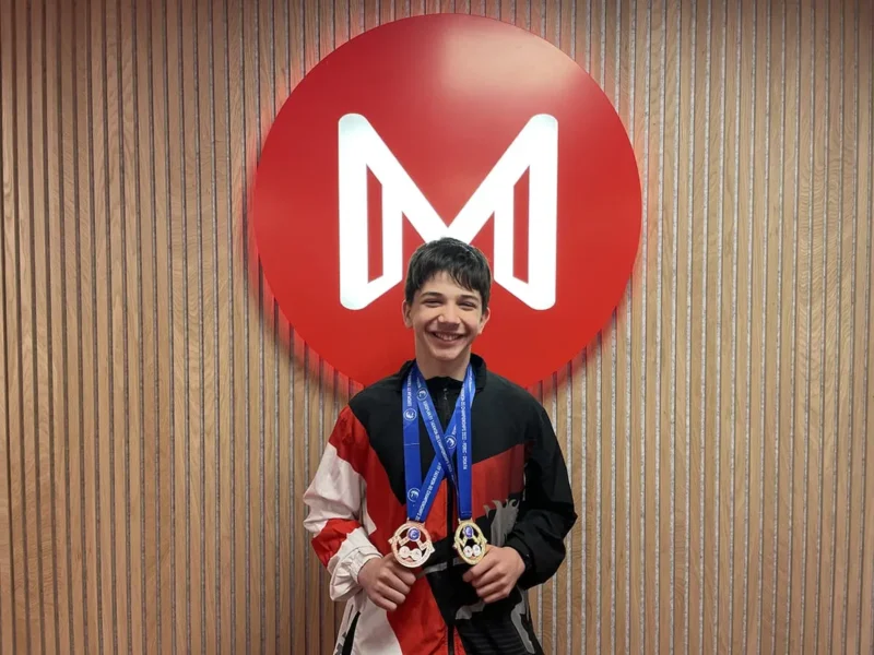 Student Naveh Kraus showing off his ITF Taekwondo European Championships 2022 medals.